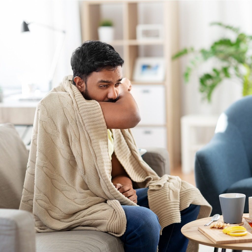 Sick Young Man In Blanket Coughing At Home Picture Id1282258603