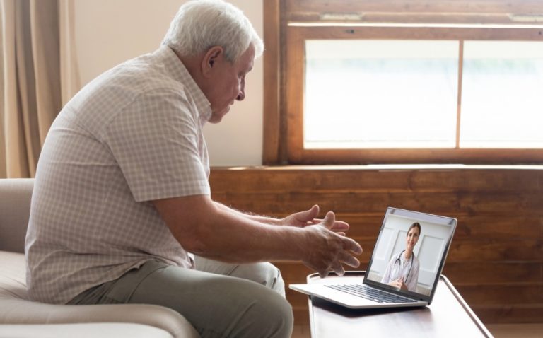 Elderly Man Make Distant Video Call Communicating With Doctor Online Picture Id1182248151
