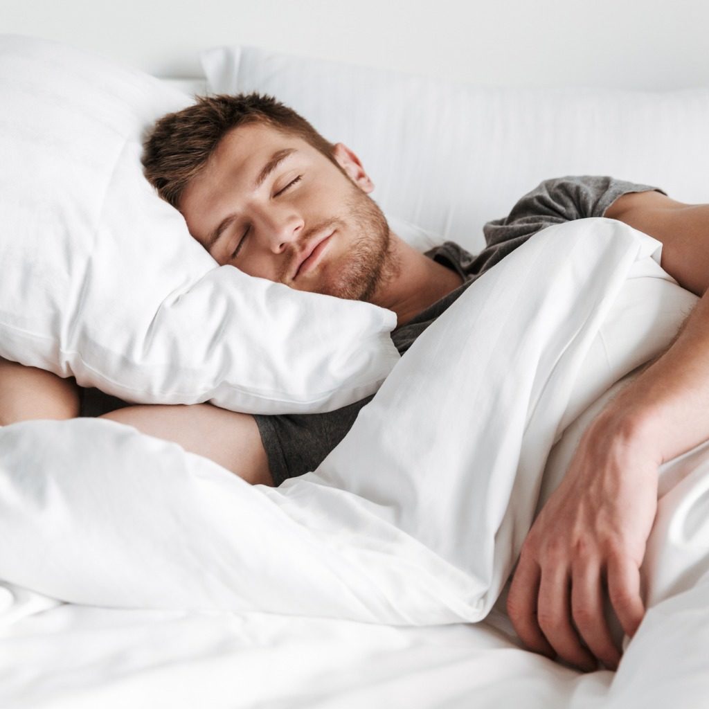 Handsome Young Man Sleeping In Bed Picture Id1326080733
