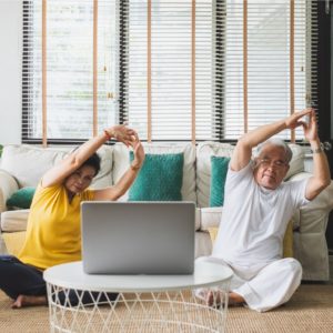 Asian Old Senior Workout Exercise And Doing Yoga At Home.